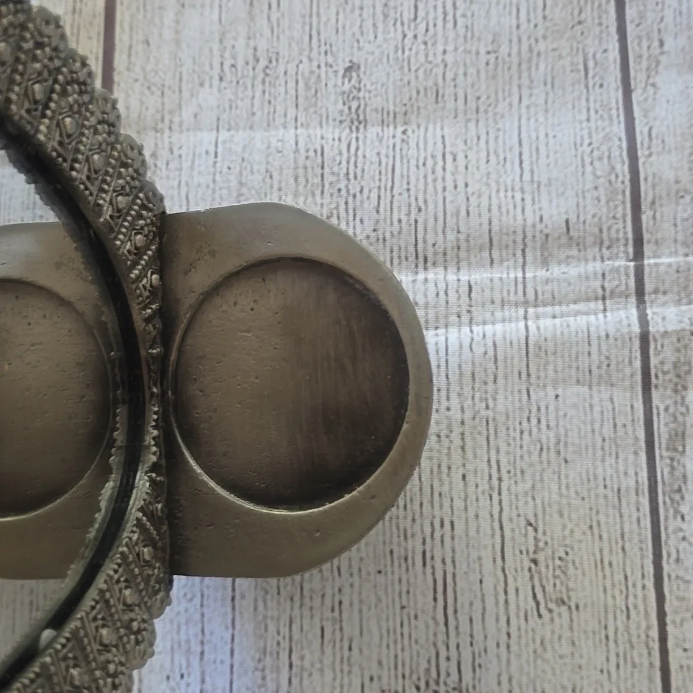 Set of 2 new silver, oval shaped ornate mirror sconces.